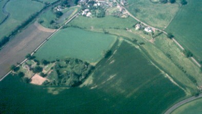 Plate 1. Aerial photo. The church is bottom left, the village top centre, with “The Moathouse” the site of the Trussell manor house, to its left.